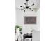 Tastefully decorated dining area features an eye-catching starburst light fixture and artwork at 5300 E Cherry Creek South Dr # 620, Denver, CO 80246