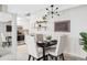 Cozy dining area with a black table, seating for four, and a modern light fixture at 5300 E Cherry Creek South Dr # 620, Denver, CO 80246