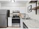 Well-maintained kitchen with stainless steel appliances and granite countertops, a culinary haven at 5300 E Cherry Creek South Dr # 620, Denver, CO 80246