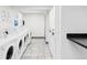 Community laundry room featuring multiple washing machines and dryers at 5300 E Cherry Creek South Dr # 620, Denver, CO 80246