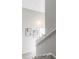 Stairway with modern decor leads to a bright, sunlit upper level at 5300 E Cherry Creek South Dr # 620, Denver, CO 80246