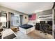 Comfortable bedroom with natural light, neutral decor, and ample space for a cozy retreat at 8337 S Upham Way # 103, Littleton, CO 80128