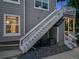 Exterior of the unit showing stairs leading to porch and upstairs balcony at 8337 S Upham Way # 103, Littleton, CO 80128