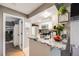 Well-lit kitchen featuring granite countertops, stainless steel appliances, and an open view to another room at 8337 S Upham Way # 103, Littleton, CO 80128