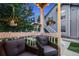 Charming porch with comfortable seating and hanging flower baskets at 8337 S Upham Way # 103, Littleton, CO 80128