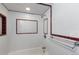 This charming bathroom features white tile with decorative trim and a shower at 1008 N Corona St # 405, Denver, CO 80218