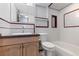 Bathroom featuring a vanity, toilet and a tiled tub and shower at 1008 N Corona St # 405, Denver, CO 80218