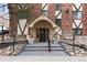 An inviting entrance with planters leads to the Riviera Park Condominiums at 1008 N Corona St # 405, Denver, CO 80218