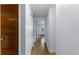 Clean, freshly painted hallway with modern wood flooring and access to multiple rooms at 1008 N Corona St # 405, Denver, CO 80218