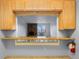 Kitchen area featuring a window looking into the living space and breakfast bar at 1008 N Corona St # 405, Denver, CO 80218