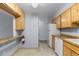 Kitchen featuring an eat in bar area with white appliances and plenty of cabinet space at 1008 N Corona St # 405, Denver, CO 80218