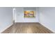Open-concept living room with stylish hardwood floors and a pass-through to the well-appointed kitchen at 1008 N Corona St # 405, Denver, CO 80218