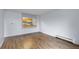 Bright, open living space featuring wood-look flooring and a clear view to the kitchen at 1008 N Corona St # 405, Denver, CO 80218
