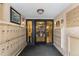 A welcoming lobby area with secure mailboxes and a glimpse of the cozy seating area at 1008 N Corona St # 405, Denver, CO 80218