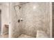 Tiled walk-in shower with bench seating, complete with a neutral design at 10490 W Jewell Ave # D, Lakewood, CO 80232