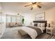 Spacious bedroom featuring natural light, a cozy rug, and calming decor for relaxation at 10490 W Jewell Ave # D, Lakewood, CO 80232