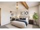 Serene bedroom with a bed, large window, and wood beam, offering a calming retreat at 10490 W Jewell Ave # D, Lakewood, CO 80232