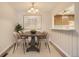 Inviting dining room featuring modern light fixture, stylish table, and a serene atmosphere for Gathering meals at 10490 W Jewell Ave # D, Lakewood, CO 80232
