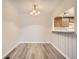 Inviting dining room features wood floors and modern lighting, perfect for Gathering meals and entertaining guests at 10490 W Jewell Ave # D, Lakewood, CO 80232