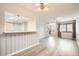 Bright, open living area with wood floors, large windows, and neutral decor provides a welcoming atmosphere at 10490 W Jewell Ave # D, Lakewood, CO 80232