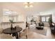 Bright living room with modern lighting, neutral tones, and open-concept design for easy entertaining at 10490 W Jewell Ave # D, Lakewood, CO 80232
