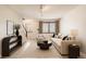 Bright living area with a comfortable couch, natural light, and stylish decor for a modern home at 10490 W Jewell Ave # D, Lakewood, CO 80232