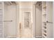 Spacious walk-in closet with custom shelving offers plenty of room for storage and organization at 10490 W Jewell Ave # D, Lakewood, CO 80232