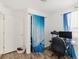 Bedroom featuring desk, closet with curtain and window at 1748 Eagle St # B, Aurora, CO 80011