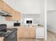 Open kitchen layout with neutral tones, modern appliances, and ample counter space at 1748 Eagle St # B, Aurora, CO 80011
