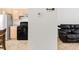 Neutral toned kitchen and sitting area offering modern appliances and bright light at 1748 Eagle St # B, Aurora, CO 80011