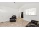Bright living space with tile floors, neutral walls, and comfortable leather seating at 1748 Eagle St # B, Aurora, CO 80011