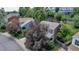 A high angle view of a suburban neighborhood street filled with mature trees and landscaping at 573 Entrada Dr, Golden, CO 80401