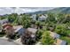 An aerial view shows a cozy neighborhood with a two-story home and meticulously landscaped yards at 573 Entrada Dr, Golden, CO 80401