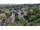 Neighborhood aerial view showcases well-maintained homes, mature trees, community streetscapes, and the home's desirable location at 573 Entrada Dr, Golden, CO 80401