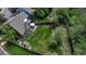 Bird's-eye view of large backyard with a manicured lawn, patio seating, a play area, and a wooden privacy fence at 573 Entrada Dr, Golden, CO 80401