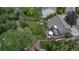 Aerial view of fenced backyard, patio with outdoor seating, and lush landscaping at 573 Entrada Dr, Golden, CO 80401