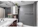 Modern bathroom with sleek fixtures, a framed mirror, and a stylish vanity with dark wood accents at 573 Entrada Dr, Golden, CO 80401