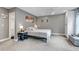 Comfortable bedroom features soft carpet, a ceiling fan, ample natural light and an ensuite bathroom at 573 Entrada Dr, Golden, CO 80401