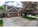 Charming two-story home with a two-car garage and well-maintained landscaping at 573 Entrada Dr, Golden, CO 80401