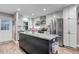 Modern kitchen with stainless steel appliances, a kitchen island with granite counters and recessed lighting at 573 Entrada Dr, Golden, CO 80401