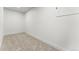Finished basement storage area with fresh paint and carpeted flooring at 4043 E Geddes Cir, Centennial, CO 80122