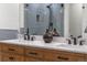 Bathroom featuring a double vanity with marble countertop and modern fixtures at 4043 E Geddes Cir, Centennial, CO 80122