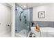 Modern bathroom featuring a glass-enclosed shower and elegant soaking tub at 4043 E Geddes Cir, Centennial, CO 80122