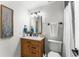 Bright bathroom features a wood vanity with a marble countertop and modern fixtures at 4043 E Geddes Cir, Centennial, CO 80122