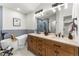 Bright bathroom with double vanity, freestanding tub and sleek, modern fixtures at 4043 E Geddes Cir, Centennial, CO 80122