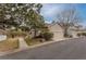 Charming home with a well-kept lawn, convenient driveway, and an attached two-car garage at 4043 E Geddes Cir, Centennial, CO 80122