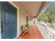 Inviting front porch with seating area perfect for enjoying the outdoors at 4043 E Geddes Cir, Centennial, CO 80122