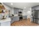 Modern kitchen with gray cabinetry, stainless steel appliances, and sleek countertops at 4043 E Geddes Cir, Centennial, CO 80122