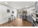 Charming kitchen with sleek countertops, gray cabinetry, stainless steel appliances, and a bar eating area at 4043 E Geddes Cir, Centennial, CO 80122