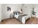 Primary bedroom features modern decor with wood floors and neutral colors at 4043 E Geddes Cir, Centennial, CO 80122